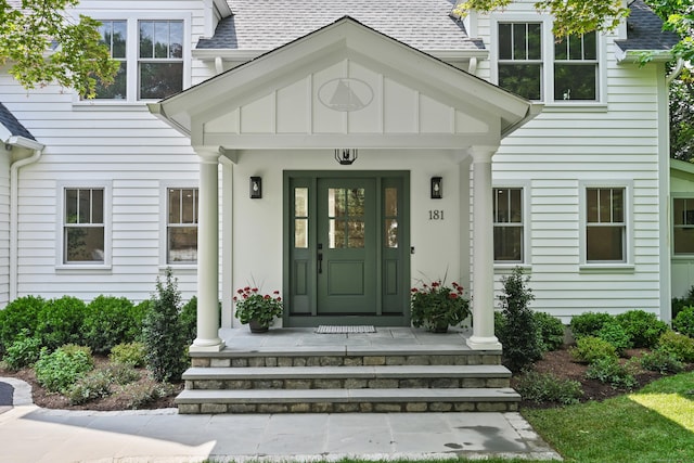 181 Highland Ave, Norwalk, CT 06853 - property entrance featuring a shingled roof