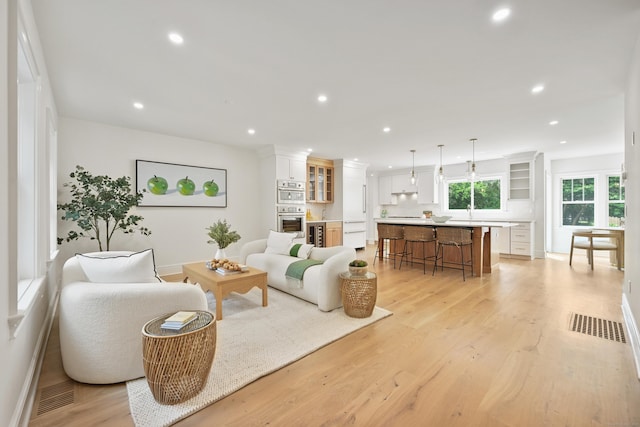 181 Highland Ave, Norwalk, CT 06853 - living area with recessed lighting and light wood-style flooring