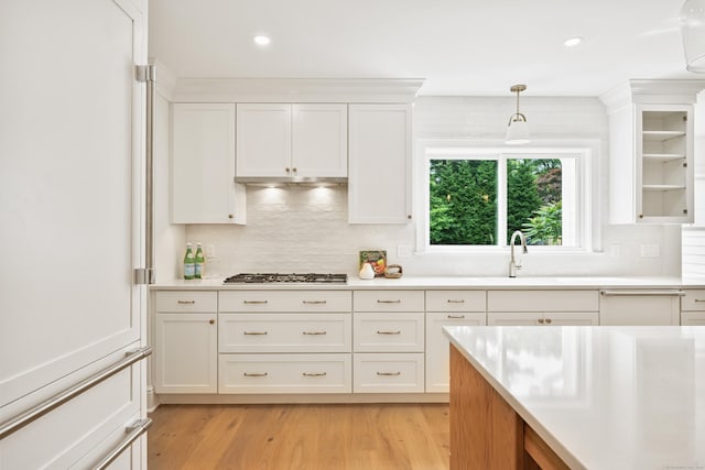 181 Highland Ave, Norwalk, CT 06853 - kitchen featuring white cabinets, light countertops, stainless steel gas stovetop, decorative backsplash, and recessed lighting