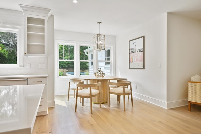 181 Highland Ave, Norwalk, CT 06853 - dining room with light wood-type flooring, a chandelier, and recessed lighting