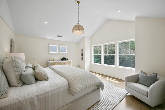 181 Highland Ave, Norwalk, CT 06853 - bedroom featuring recessed lighting, high vaulted ceiling, and wood finished floors