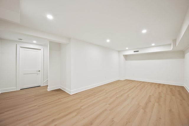 181 Highland Ave, Norwalk, CT 06853 - finished below grade area with light wood-style flooring and recessed lighting