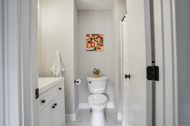 17 Hollow Tree Ln Unit 17, Monroe, CT 06468 - bathroom with vanity, toilet, baseboards, and tile patterned floors