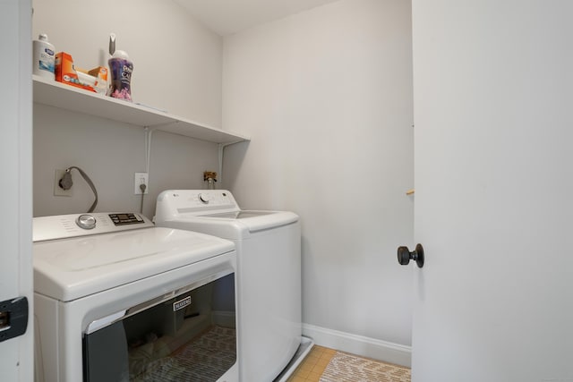 17 Hollow Tree Ln Unit 17, Monroe, CT 06468 - washroom featuring washing machine and dryer, baseboards, and light tile patterned floors