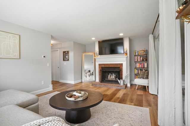 17 Hollow Tree Ln Unit 17, Monroe, CT 06468 - living room with wood finished floors, a brick fireplace, baseboards, and recessed lighting
