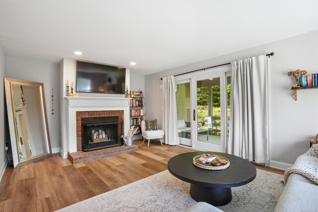 17 Hollow Tree Ln Unit 17, Monroe, CT 06468 - living room featuring a fireplace, wood finished floors, baseboards, and recessed lighting