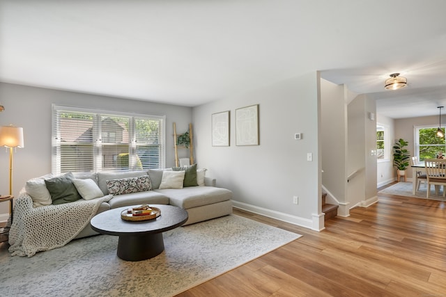 17 Hollow Tree Ln Unit 17, Monroe, CT 06468 - living area featuring light wood-type flooring, baseboards, and stairway