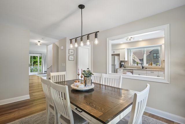 17 Hollow Tree Ln Unit 17, Monroe, CT 06468 - dining space featuring wood finished floors, baseboards, and a chandelier