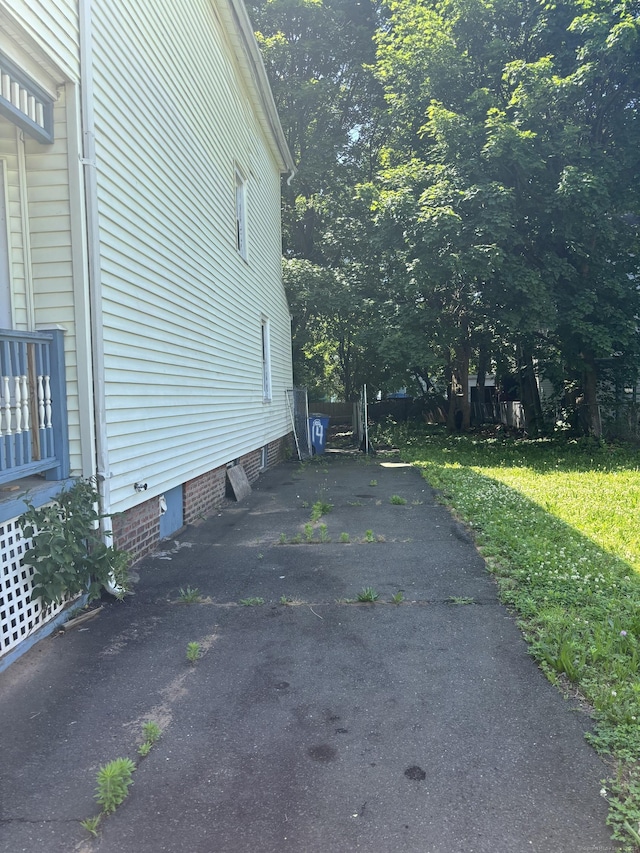 14 Judson Ave, New Haven, CT 06511 - view of side of property with asphalt driveway and crawl space