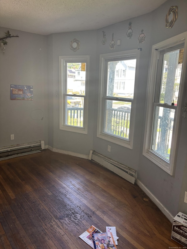 14 Judson Ave, New Haven, CT 06511 - empty room featuring a baseboard radiator, a baseboard heating unit, wood-type flooring, and a textured ceiling
