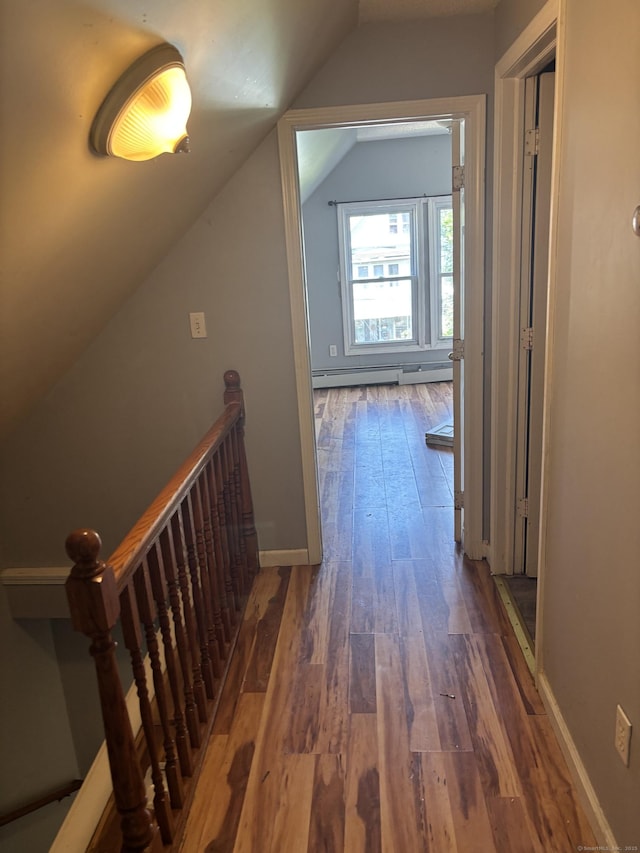 14 Judson Ave, New Haven, CT 06511 - corridor with vaulted ceiling, wood-type flooring, an upstairs landing, and a baseboard radiator