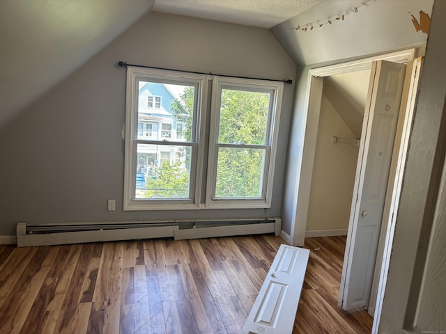 14 Judson Ave, New Haven, CT 06511 - bonus room with vaulted ceiling, baseboard heating, wood finished floors, and a textured ceiling
