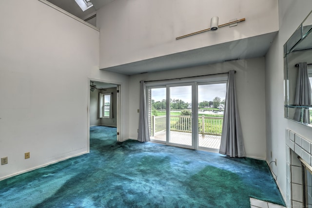 74 Quarry Dock Rd Unit 74, Branford, CT 06405 - unfurnished living room with carpet floors, baseboards, and ceiling fan