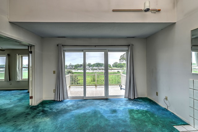 74 Quarry Dock Rd Unit 74, Branford, CT 06405 - carpeted empty room featuring healthy amount of natural light and baseboards