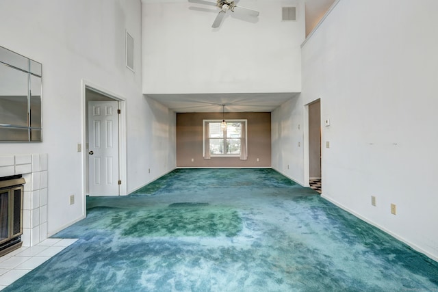74 Quarry Dock Rd Unit 74, Branford, CT 06405 - unfurnished living room featuring a high ceiling, carpet floors, a fireplace, a ceiling fan, and baseboards