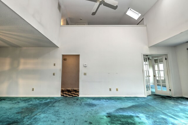74 Quarry Dock Rd Unit 74, Branford, CT 06405 - unfurnished living room with a high ceiling, a ceiling fan, carpet, french doors, and baseboards