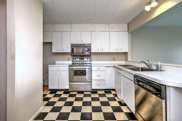 74 Quarry Dock Rd Unit 74, Branford, CT 06405 - kitchen with stainless steel appliances, a sink, light countertops, and tile patterned floors