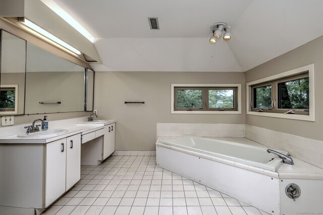 74 Quarry Dock Rd Unit 74, Branford, CT 06405 - bathroom with vaulted ceiling, double vanity, healthy amount of natural light, a garden tub, and tile patterned floors