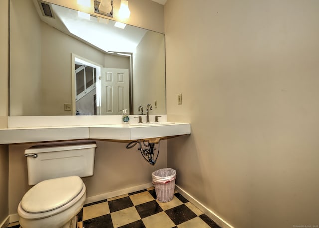 74 Quarry Dock Rd Unit 74, Branford, CT 06405 - bathroom featuring tile patterned floors, toilet, and baseboards