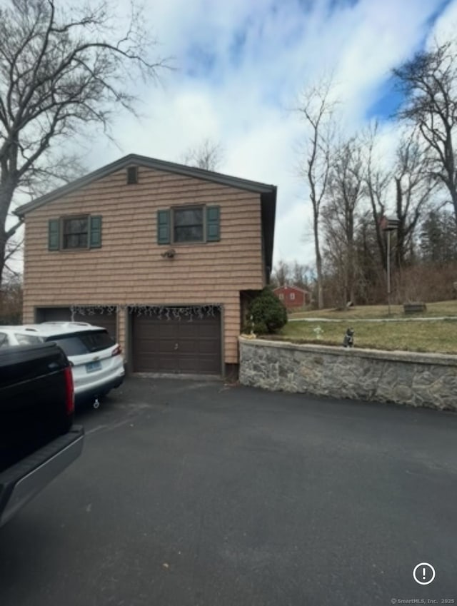 11 Arden Ave, New Fairfield, CT 06812 - view of property exterior with an attached garage and driveway