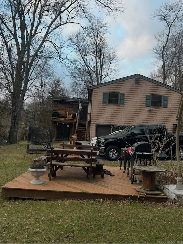 11 Arden Ave, New Fairfield, CT 06812 - rear view of house with a wooden deck, stairway, a yard, and an attached garage