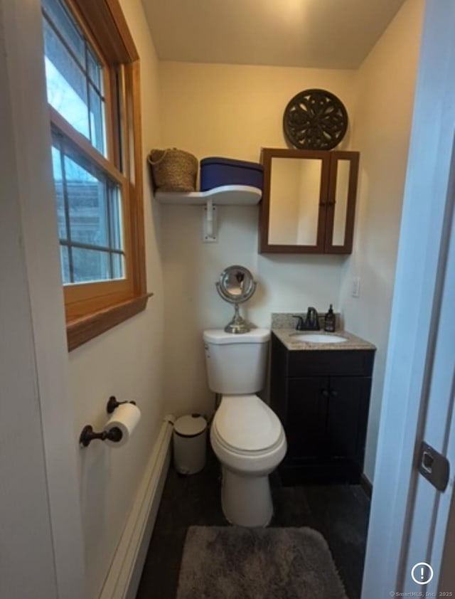 11 Arden Ave, New Fairfield, CT 06812 - bathroom featuring toilet, baseboards, and vanity