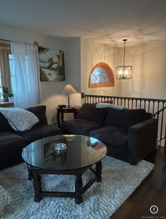 11 Arden Ave, New Fairfield, CT 06812 - living room with a chandelier and wood finished floors