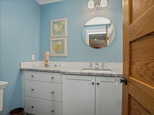 48 Harbor View Ave, Norwalk, CT 06854 - bathroom with vanity, a chandelier, and toilet