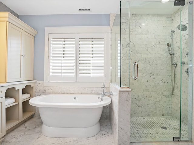 48 Harbor View Ave, Norwalk, CT 06854 - full bathroom featuring a freestanding tub, a marble finish shower, and marble look tiles