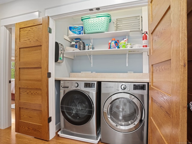48 Harbor View Ave, Norwalk, CT 06854 - laundry room with washer and clothes dryer and wood finished floors