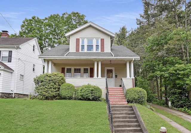 497 Commonwealth Ave, New Britain, CT 06053 - bungalow-style home with a front yard, a porch, stairway, and roof with shingles