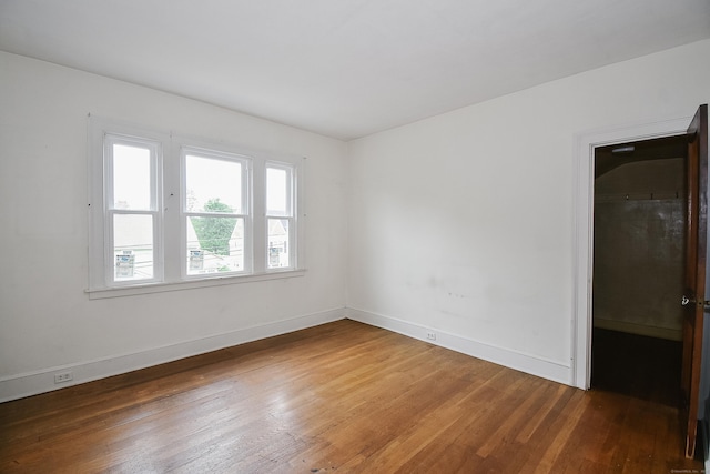 497 Commonwealth Ave, New Britain, CT 06053 - spare room with hardwood / wood-style flooring and baseboards
