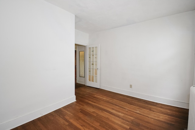 497 Commonwealth Ave, New Britain, CT 06053 - empty room featuring wood finished floors and baseboards