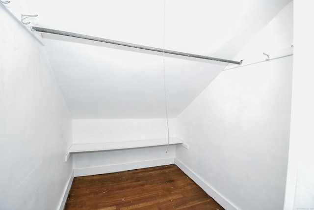 497 Commonwealth Ave, New Britain, CT 06053 - spacious closet with dark wood-style floors and lofted ceiling