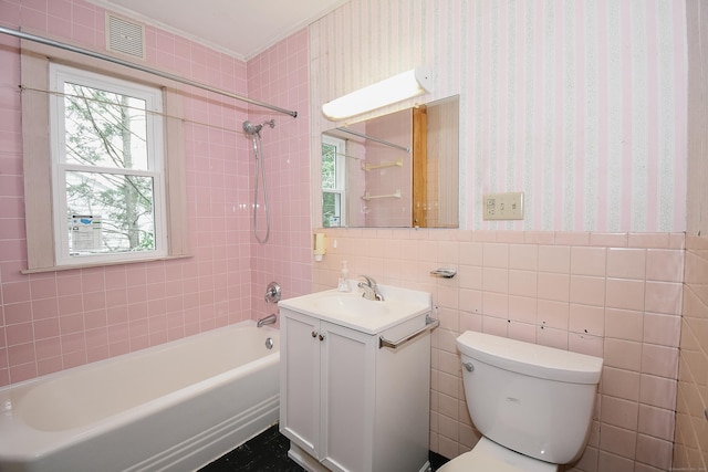 497 Commonwealth Ave, New Britain, CT 06053 - full bath with vanity, shower / bath combination, wallpapered walls, toilet, and tile walls
