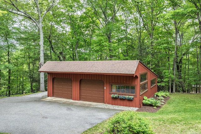 31 Philip Dr, Mansfield, CT 06268 - garage featuring a wooded view