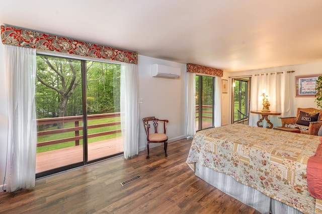 31 Philip Dr, Mansfield, CT 06268 - bedroom with a wall mounted air conditioner, access to outside, multiple windows, and dark wood-style flooring