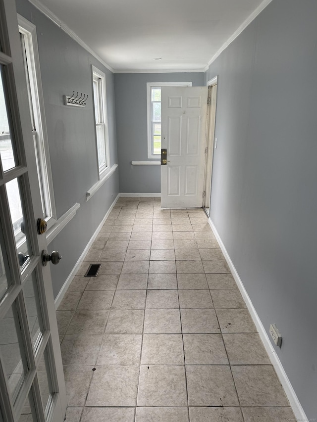 297 Laurel Ave, Bridgeport, CT 06605 - entrance foyer with light tile patterned floors, crown molding, and baseboards