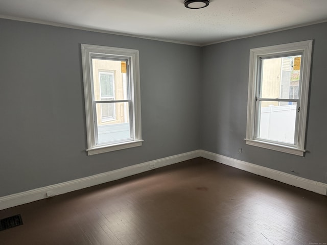 297 Laurel Ave, Bridgeport, CT 06605 - spare room with baseboards, dark wood-style floors, and crown molding