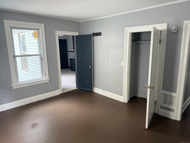 297 Laurel Ave, Bridgeport, CT 06605 - unfurnished bedroom with baseboards, ornamental molding, and a closet
