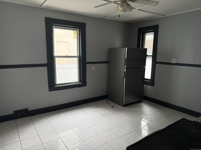 297 Laurel Ave, Bridgeport, CT 06605 - kitchen featuring freestanding refrigerator, ceiling fan, cooktop, light tile patterned floors, and baseboards