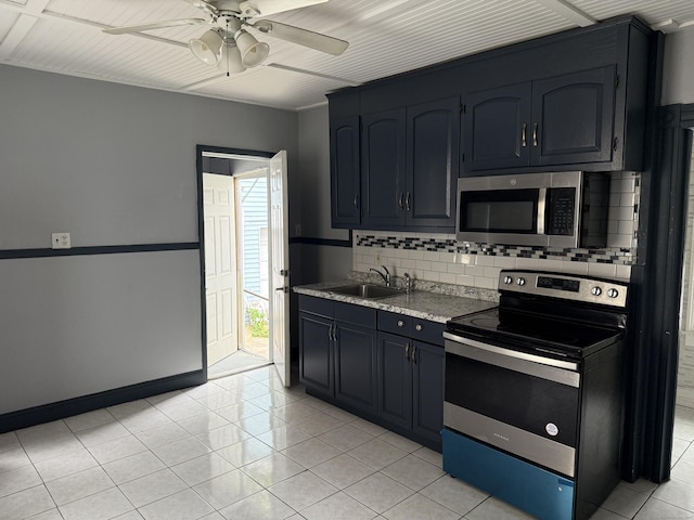 297 Laurel Ave, Bridgeport, CT 06605 - kitchen with appliances with stainless steel finishes, backsplash, a sink, a ceiling fan, and baseboards