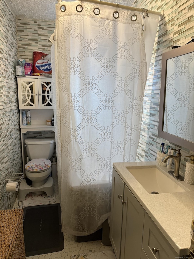 297 Laurel Ave, Bridgeport, CT 06605 - full bath with vanity, tile walls, toilet, a textured ceiling, and curtained shower