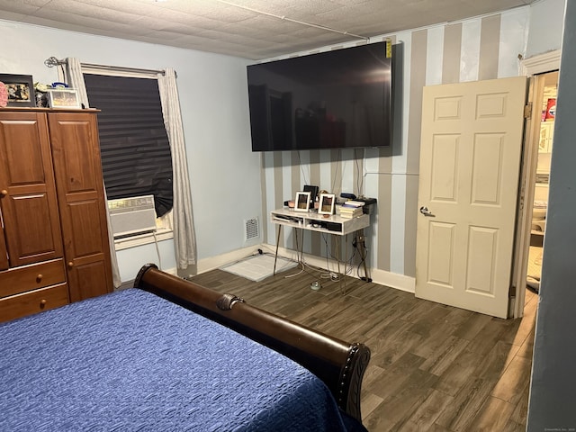 297 Laurel Ave, Bridgeport, CT 06605 - bedroom featuring dark wood finished floors, wallpapered walls, cooling unit, and baseboards