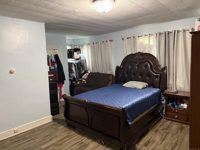 297 Laurel Ave, Bridgeport, CT 06605 - bedroom with wood finished floors, a closet, and baseboards