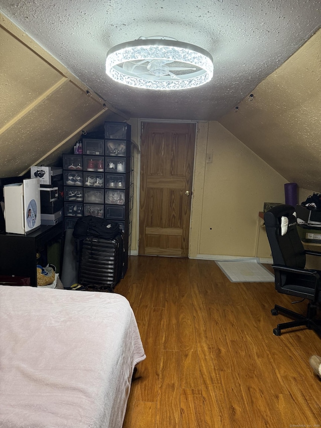 297 Laurel Ave, Bridgeport, CT 06605 - bedroom featuring a textured ceiling, vaulted ceiling, and wood finished floors