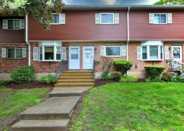 203 Edgemoor Rd Apt C, Bridgeport, CT 06606 - view of property with a front lawn, entry steps, and brick siding