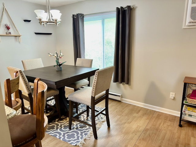 140 Hamden Ave Apt C, Waterbury, CT 06704 - dining space featuring light wood finished floors, baseboards, a chandelier, and baseboard heating