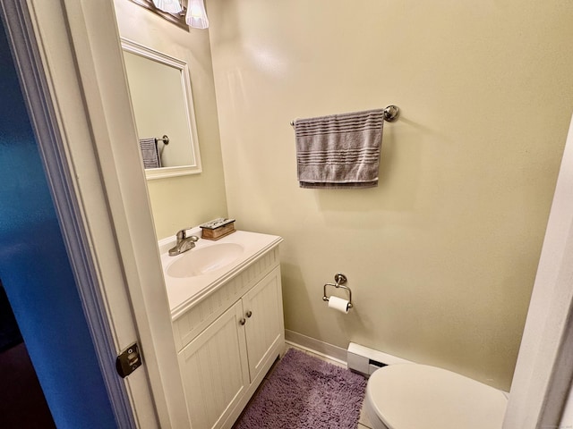 140 Hamden Ave Apt C, Waterbury, CT 06704 - half bath with baseboard heating, toilet, and vanity