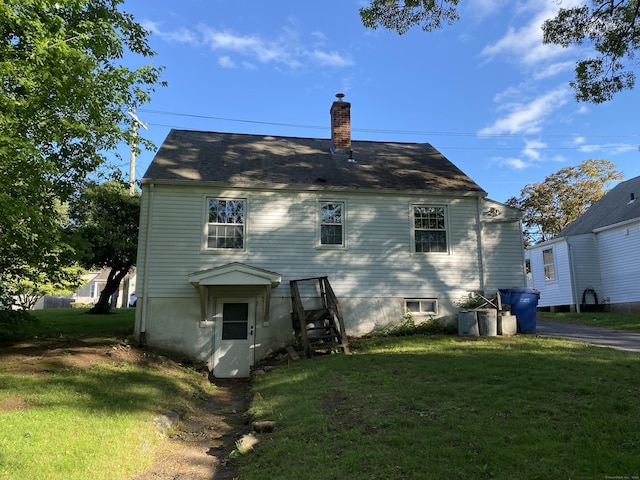 154 Wall St, Meriden, CT 06475 - back of property featuring a chimney and a yard